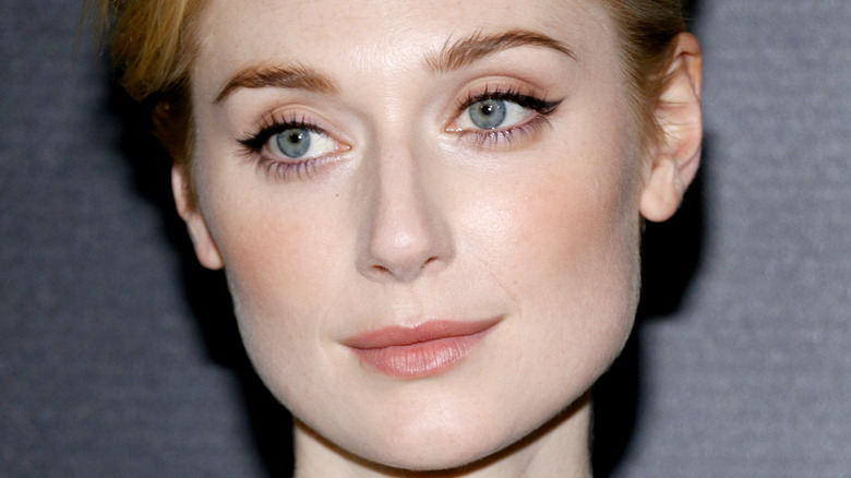 Elizabeth Debicki posing for a picture at an event