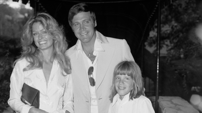Farrah Fawcett and Lee Majors smiling at their 1973 wedding