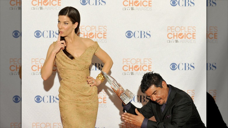 George Lopez offering Sandra Bullock an award