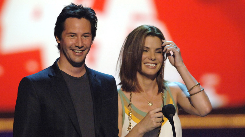 Sandra Bullock and Keanu Reeves laughing