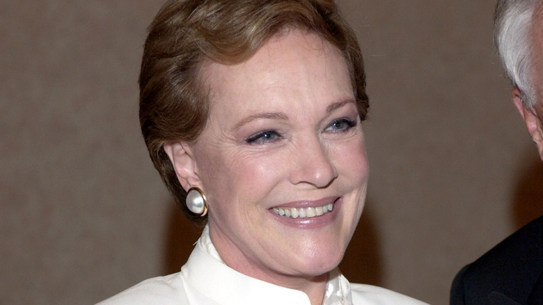 Julie Andrews in a white coat