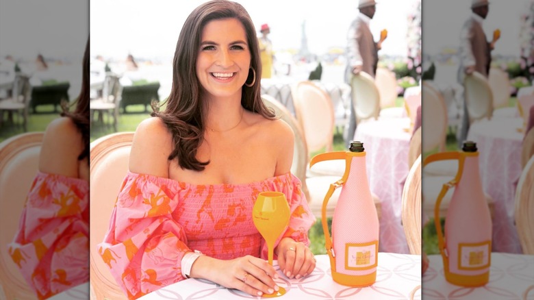 Kaitlan Collins smiling at a restaurant