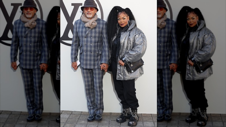 Janet Jackson holding hands with Christian Louboutin