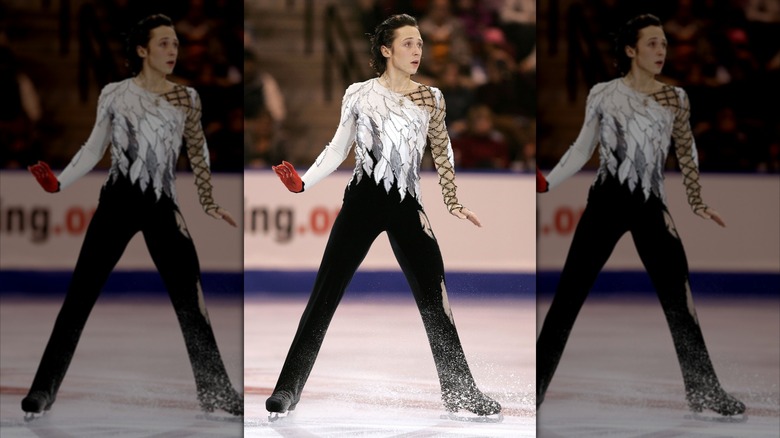 Johnny Weir in black and white swan costume at 2006 Olympics