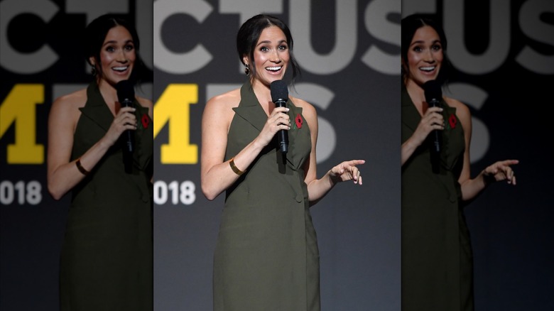 Meghan Markle wearing an olive dress at the Invictus Games Closing Ceremony in 2018.