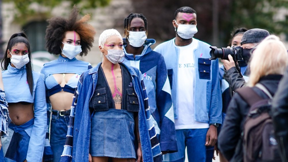 Models being photographed at Paris Fashion Week 