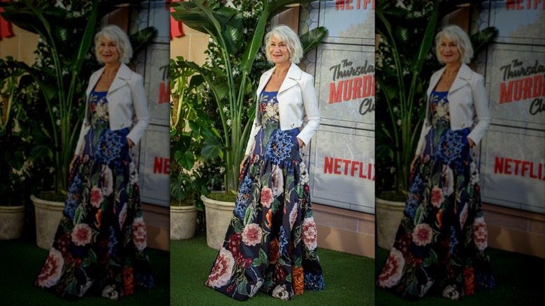 Helen Mirren in a white suit jacket and floral dress in 2025