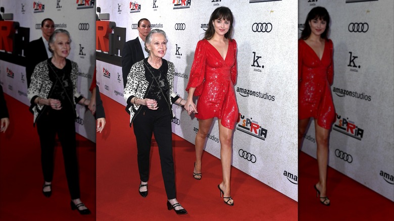 Tippi Hedren wearing cheetah print and Dakota Johnson wearing bright red