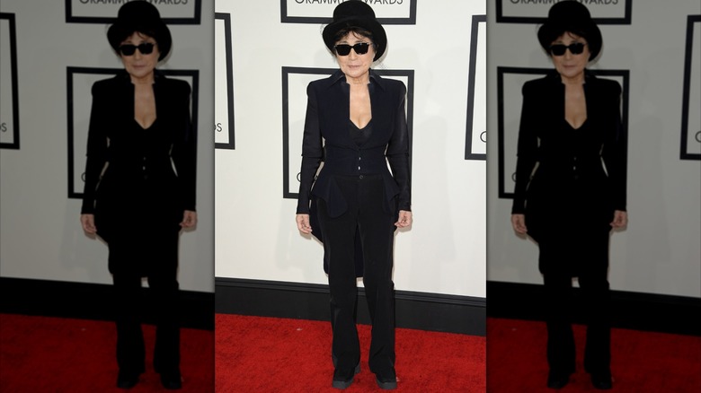 Yoko Ono wearing a black hat and dark glasses at the Grammys
