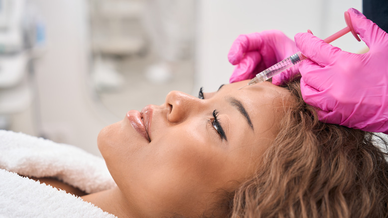 woman getting facial injection