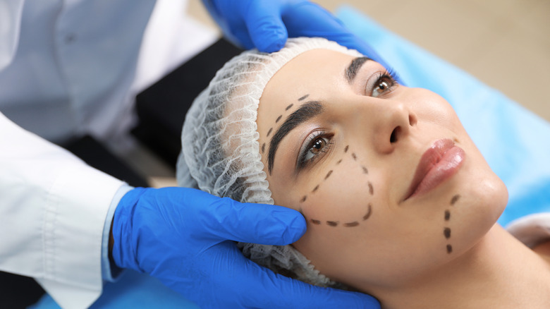 woman prepped for facial cosmetic surgery