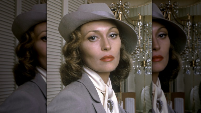 Faye Dunaway looking serious in a fedora