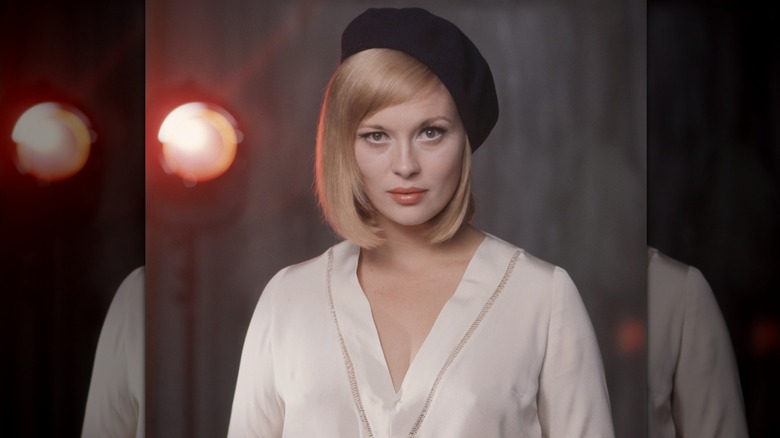 Faye Dunaway looking intent and wearing a beret
