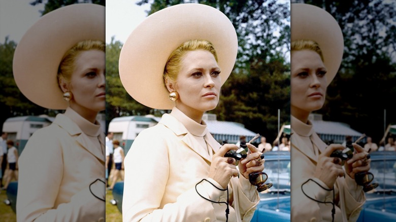 Faye Dunaway looking serious in a big hat