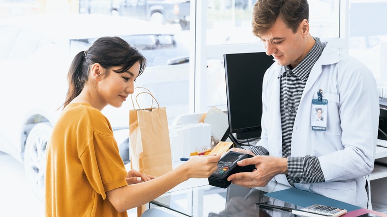 Woman buying prescription