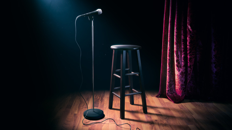 Microphone and stool set up on stage