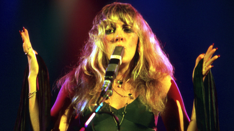 Stevie Nicks performing with Fleetwood Mac on stage in 1977