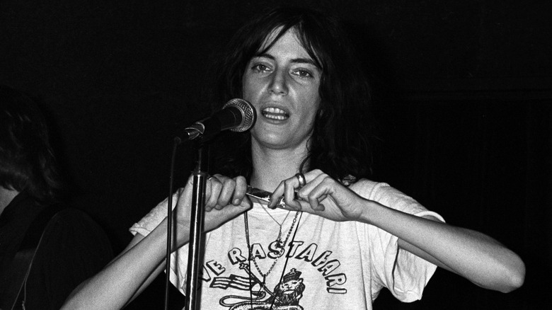 Patti Smith performing on stage in 1976