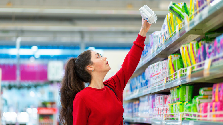 A woman shopping for wipes 