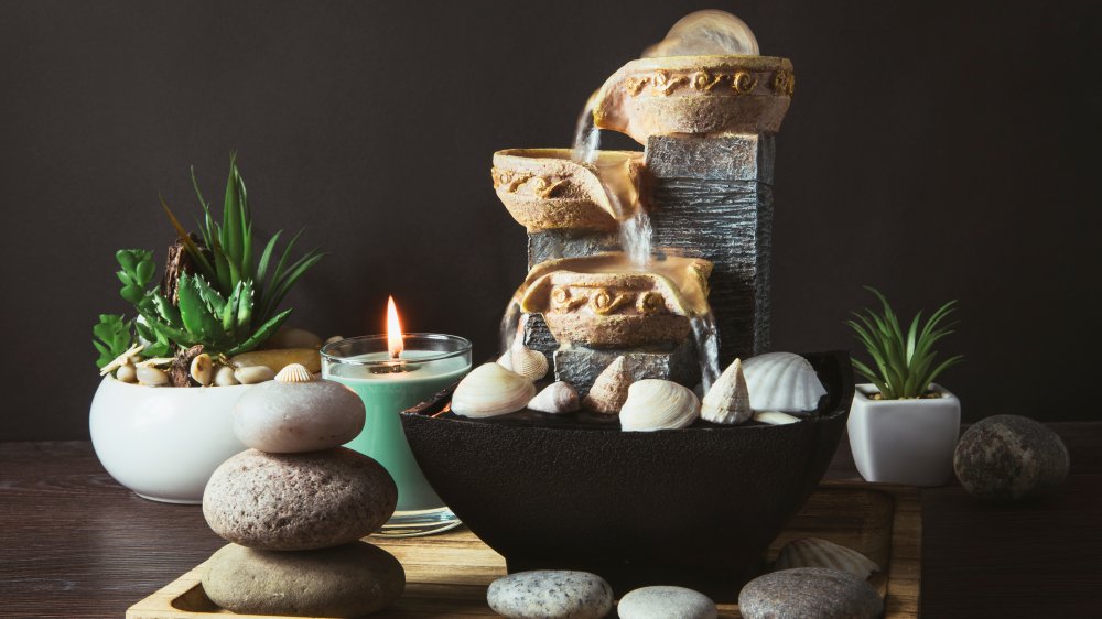 Feng shui scene with fountain, plants