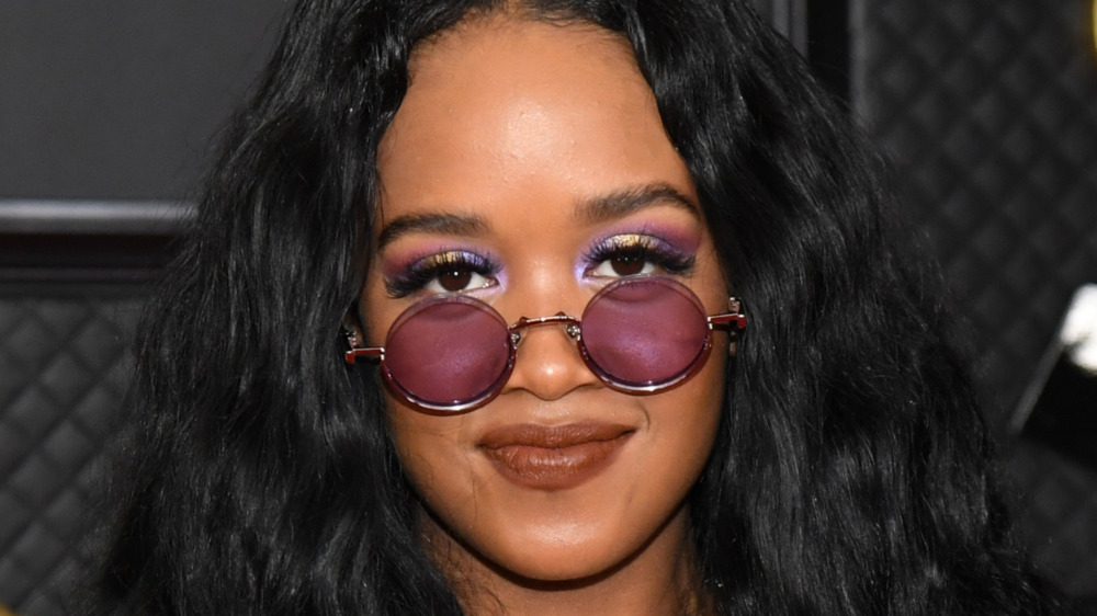 H.E.R. smiling