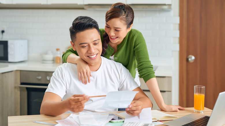 couple in front of ATM