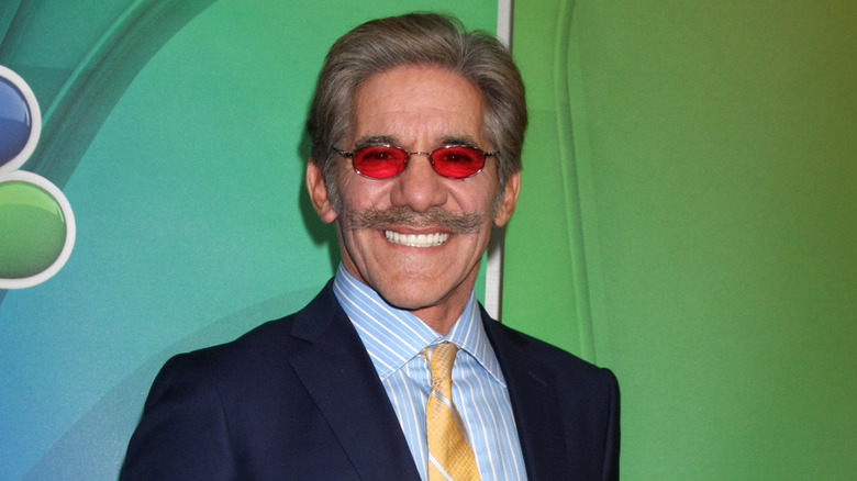 Geraldo Rivera smiling against green background