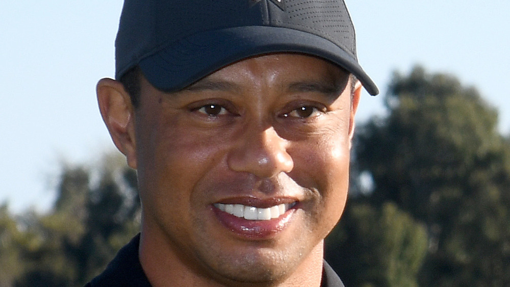 Tiger Woods smiling on golf course