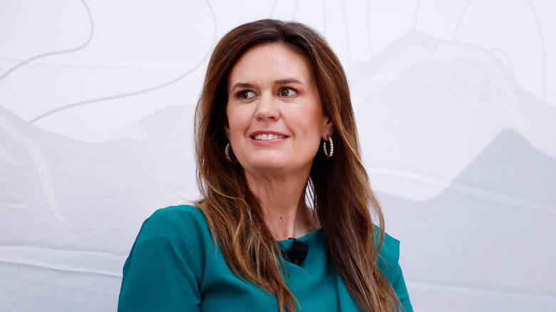 Sarah Huckabee Sanders looks off to the side