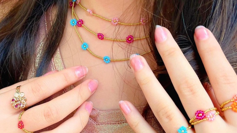 Woman wearing floral jewelry