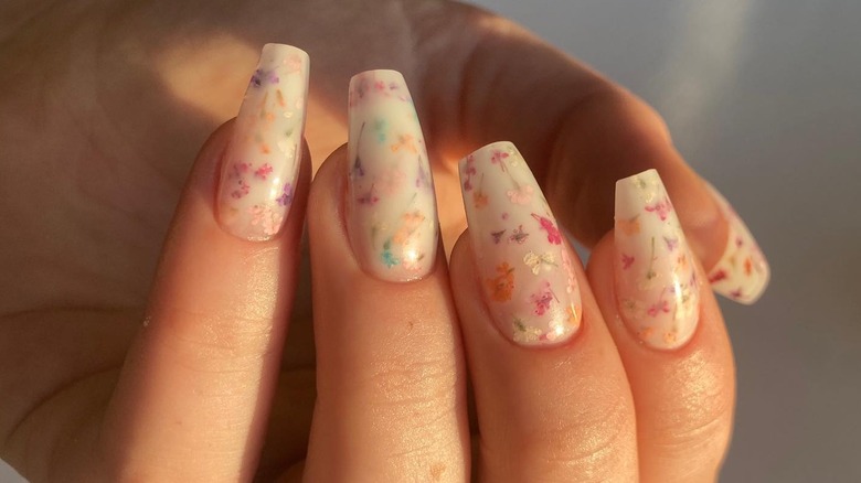 Nails showing small floral design of milk bath nails