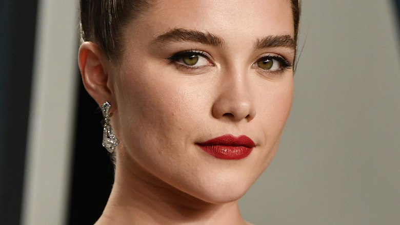 Florence Pugh smirking 