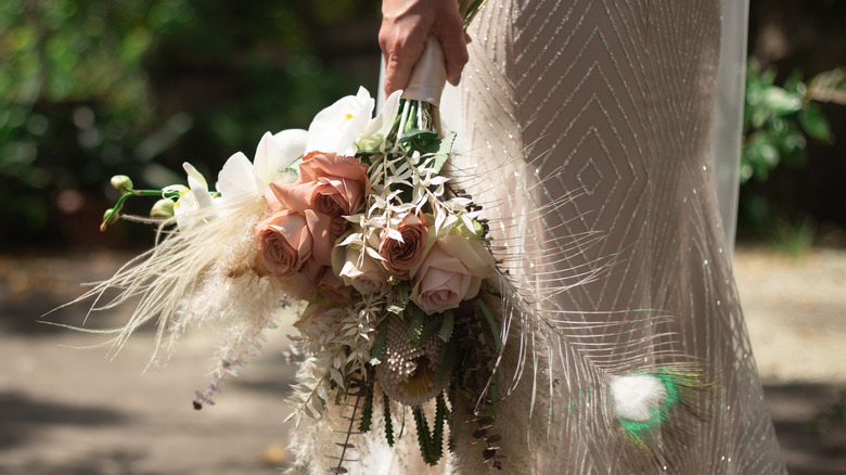bride holding wedding bouquet 