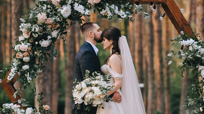 bride and groom posing