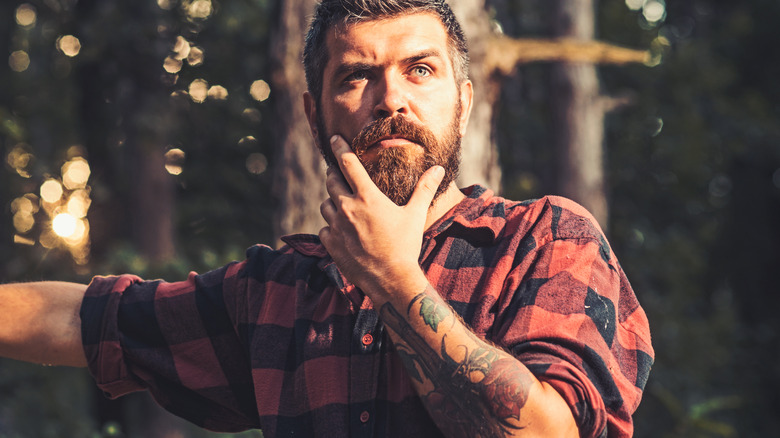 Man with a floral tattoo on arm