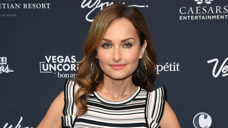 Giada De Laurentiis photographed in front of a dark blue background