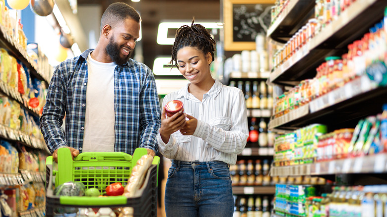 Couple shops for groceries