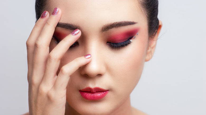 woman with bold pink makeup