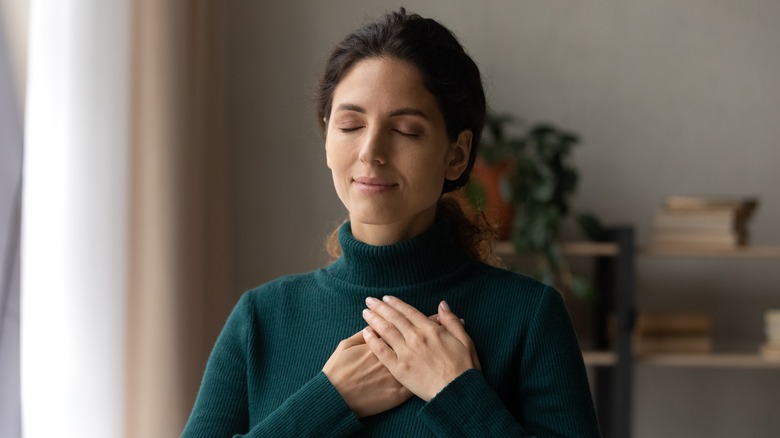 woman feeling calm practicing forgiveness