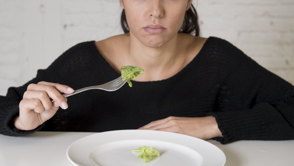 Plate with tiny piece of lettuce