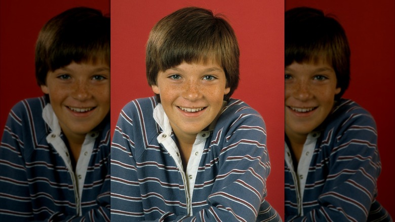 Promotional photo of Jason Bateman (wearing a blue long-sleeve shirt) in 1982