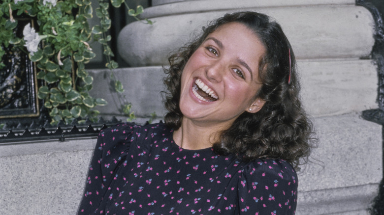 Julia Louis-Dreyfus posing for a photo in 1982