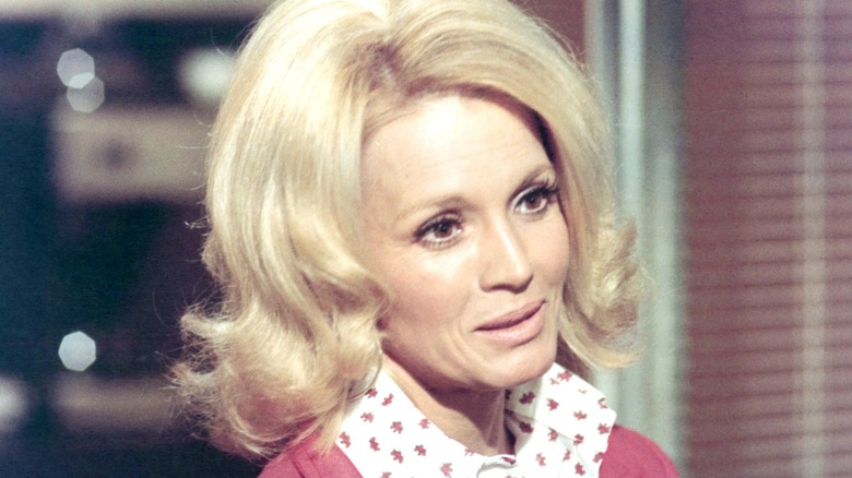 A close-up of Pepper Anderson, played by Angie Dickinson, wearing a pink blouse in a publicity still for Police Woman.