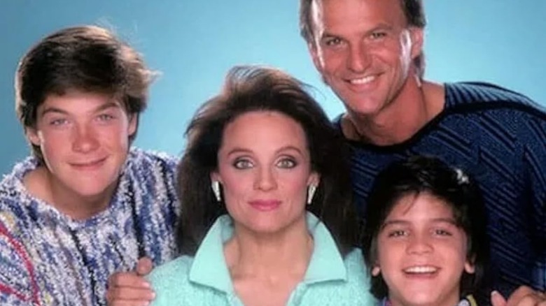 The Hogan Family cast members smiling against blue background