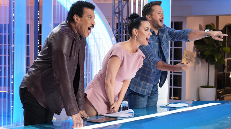 American Idol judges Lionel Richie, Katy Perry, Luke Bryan with shocked expressions