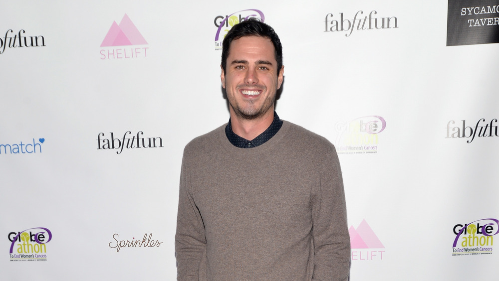 Ben Higgins wears sweater and smiles