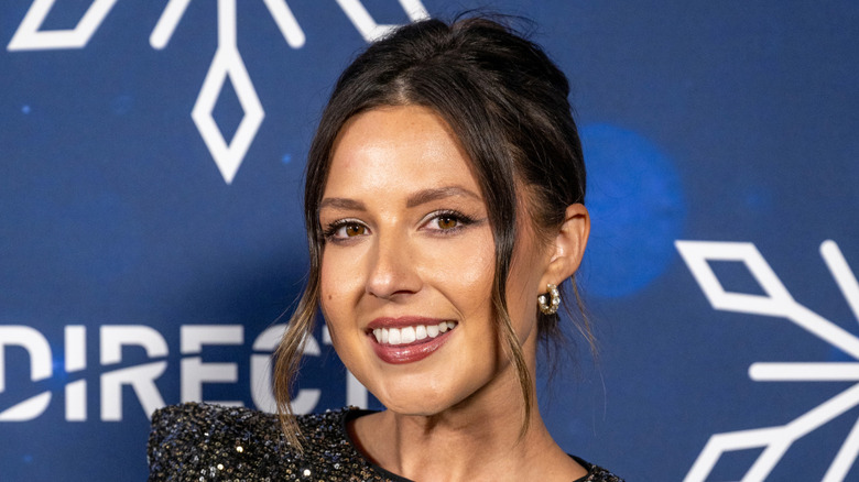 Katie Thurston smiling at an event