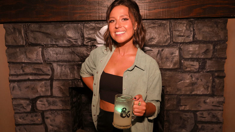 Katie Thurston holding a drink