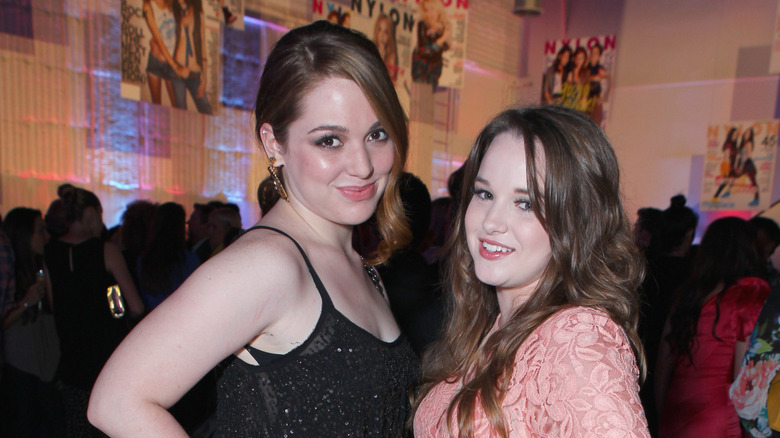 Jennifer Stone and Kay Panabaker smiling and posing together in their child star days