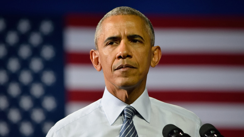 President Barack Obama standing in front of microphone